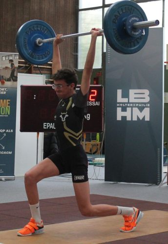 Un peu de fatigue Ethan à l'épaulé.  E. jeté 128kg